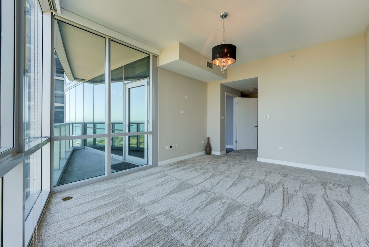 1201 South Prairie Avenue, Unit 1803 Chicago, IL 60605 - Photo 5 of 27 a view of a hallway with wooden floor and door