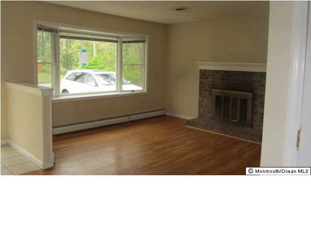 184 Wave Road Manahawkin, NJ 08050 - Photo 11 of 12 a black and white photo of a living room