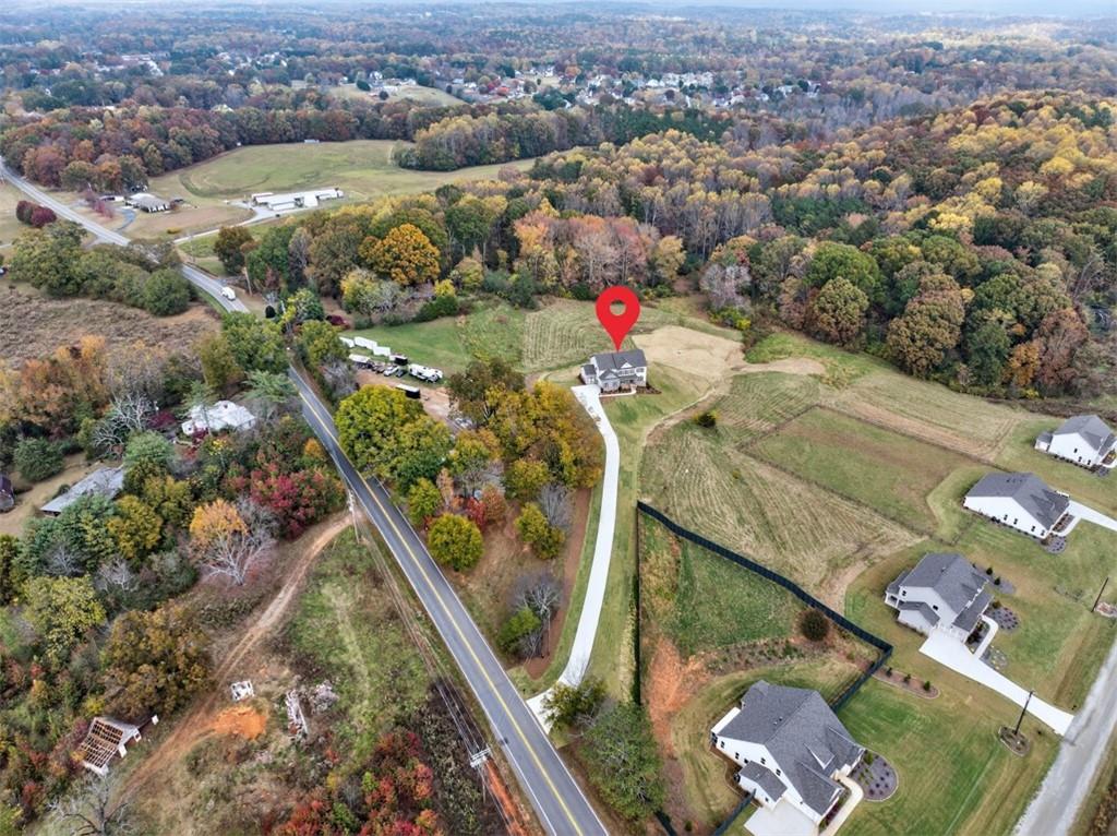 8845 Jot Em Down Road Gainesville, GA 30506 - Photo 84 of 87 an aerial view of residential houses with outdoor space
