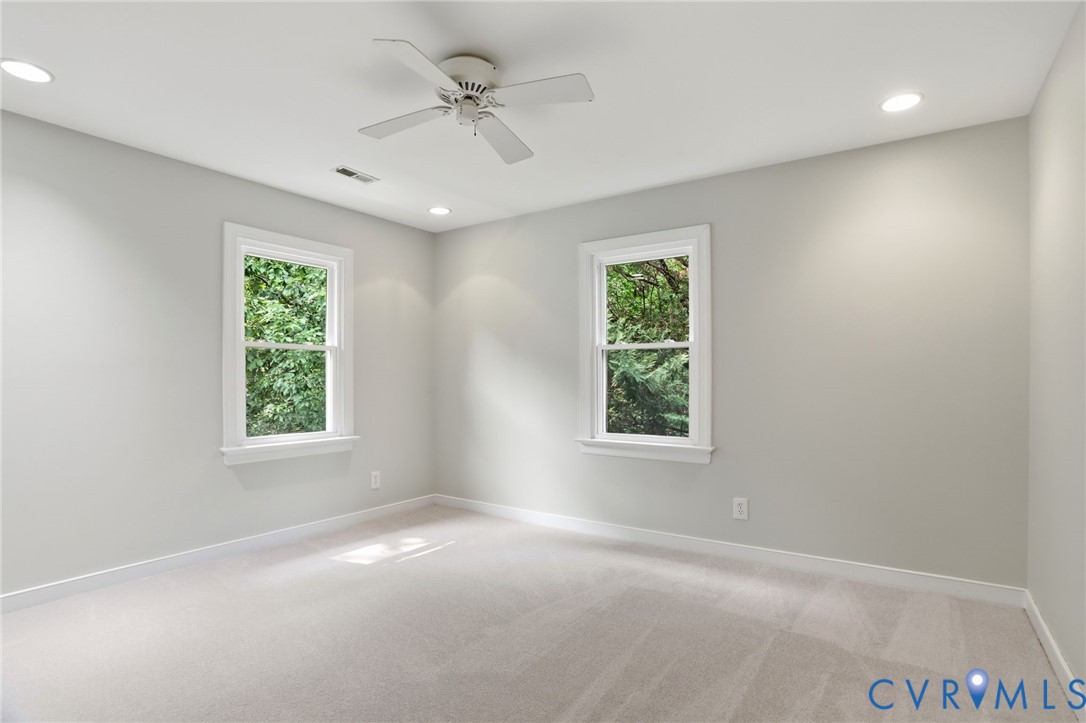 2904 Old Gun Road West Midlothian, VA 23113 - Photo 31 of 59 Carpeted room featuring two white-framed windows,