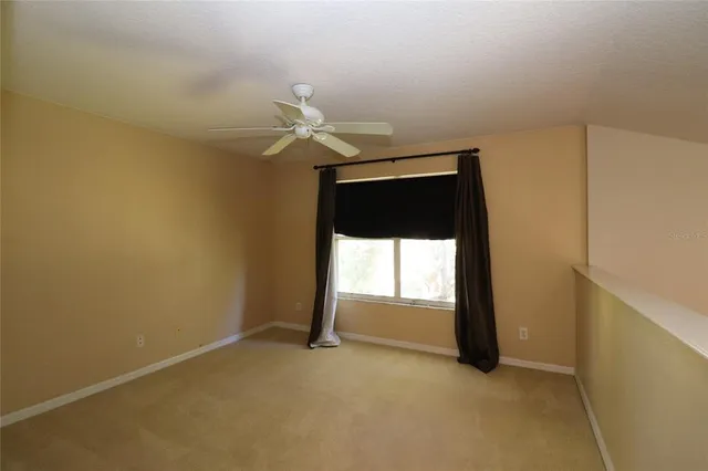a view of a hallway with a chandelier
