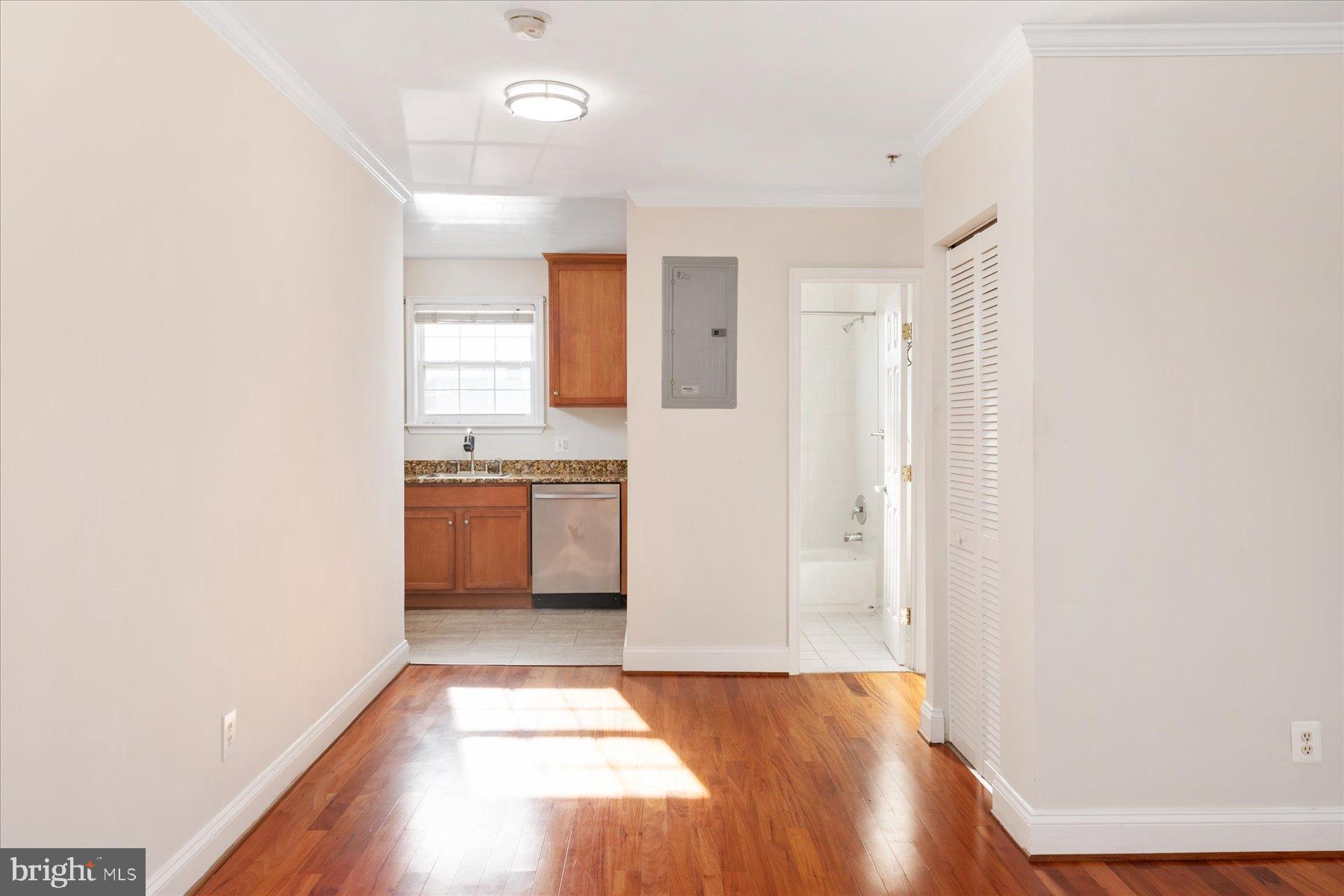 19 Post, Unit AVENUE 203 Laurel, MD 20707 - Photo 12 of 32 a view of a kitchen with a sink and a window