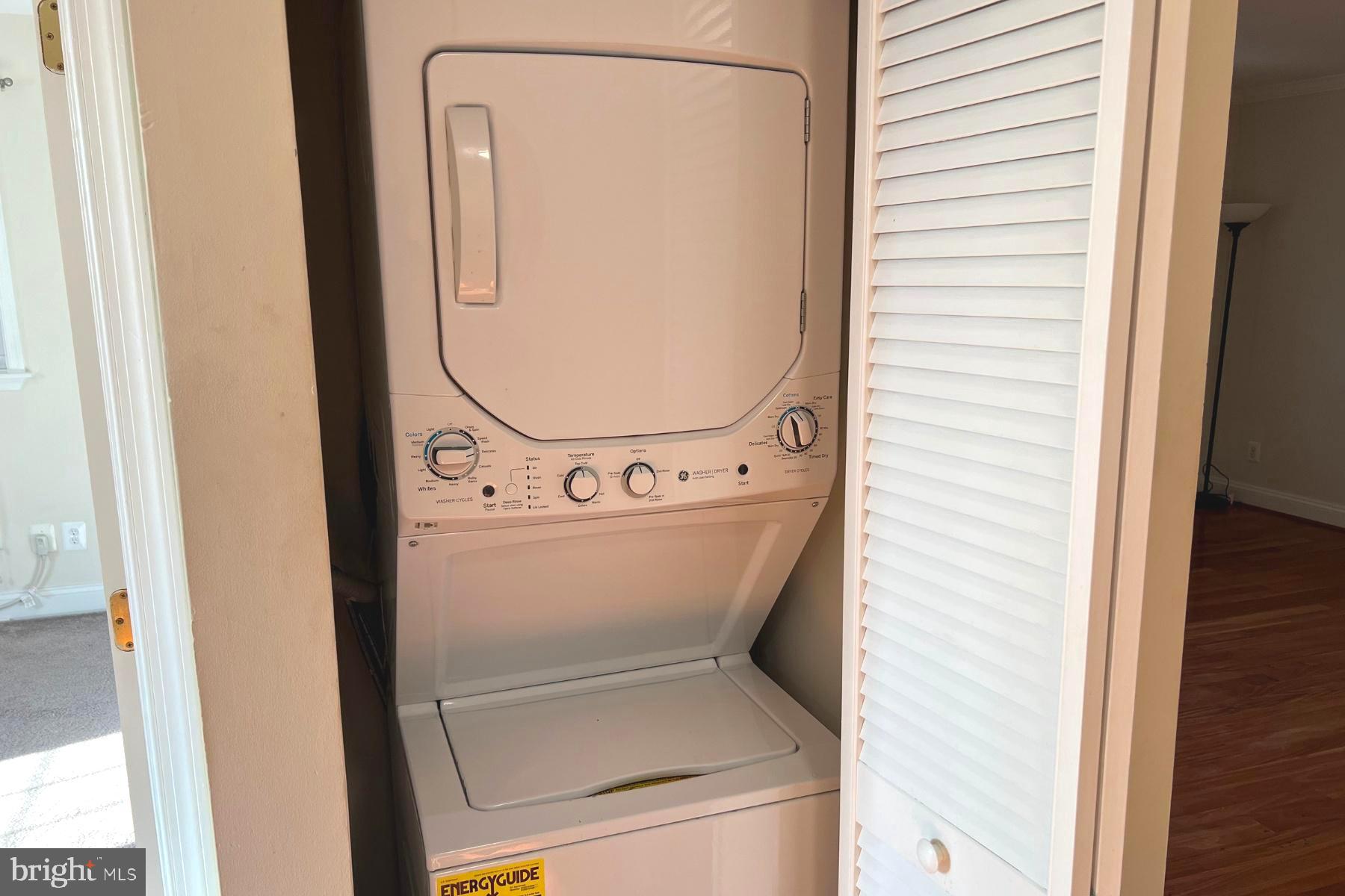 19 Post, Unit AVENUE 203 Laurel, MD 20707 - Photo 18 of 32 a utility room with dryer and washer