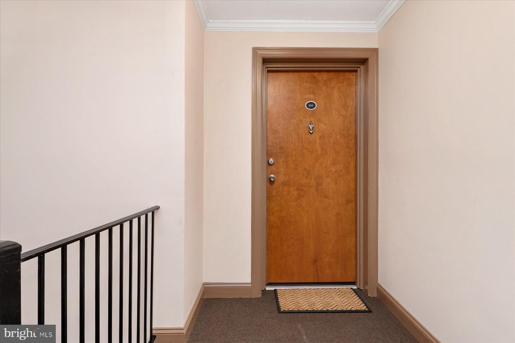 19 Post, Unit AVENUE 203 Laurel, MD 20707 - Photo 6 of 32 a view of a hallway with wooden floor
