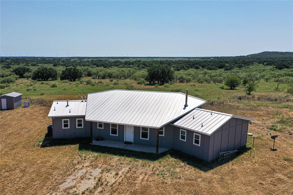 131.7-acres Roney Road Jacksboro, TX 76458 - Photo 4 of 40 an aerial view of a house next to a big yard