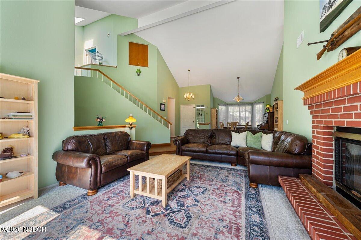 892 Onstott Road Lompoc, CA 93436 - Photo 6 of 40 a living room with furniture and a fireplace