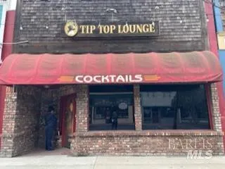 a front view of a building with retail sign board