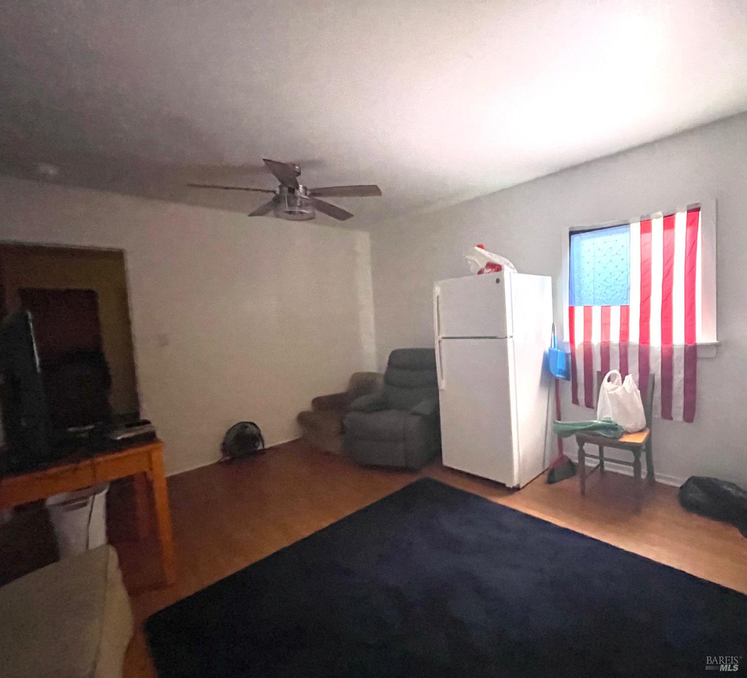 321 North Franklin Street Fort Bragg, CA 95437 - Photo 21 of 23 a living room with furniture and a flat screen tv