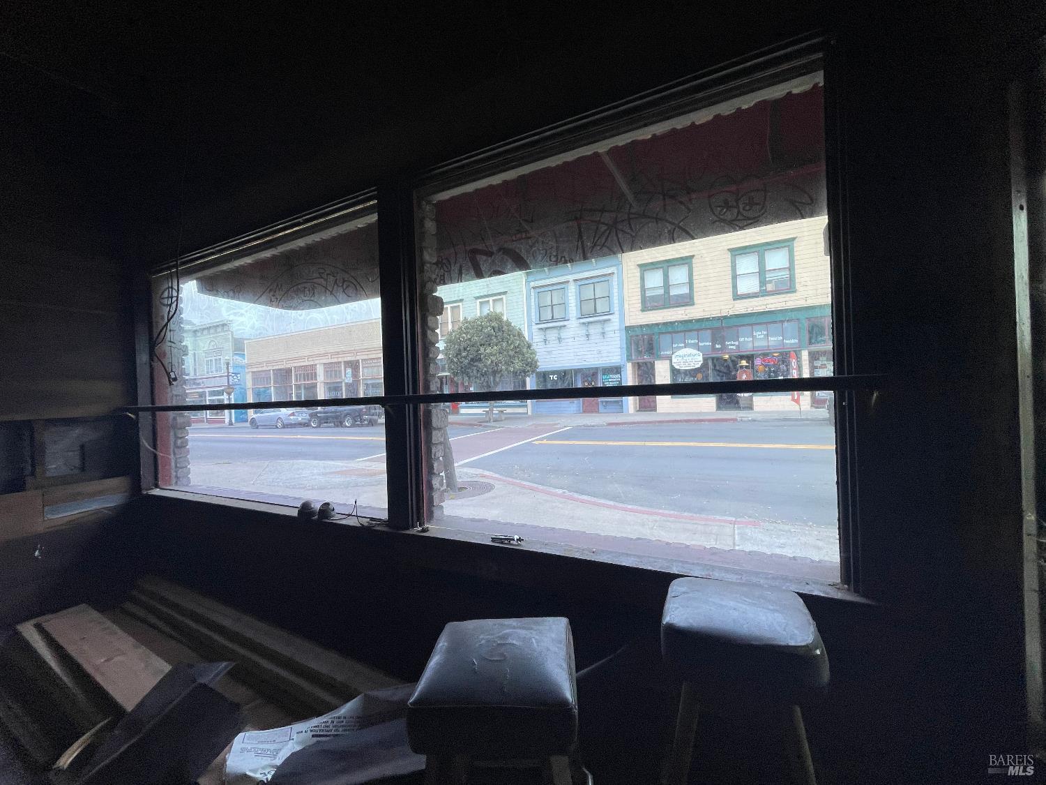 321 North Franklin Street Fort Bragg, CA 95437 - Photo 4 of 23 a view of a living room with a floor to ceiling window and wooden floor