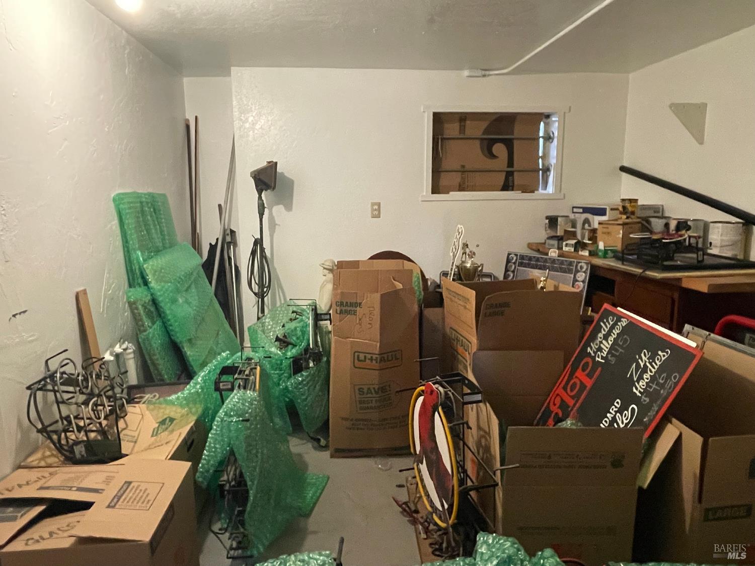 321 North Franklin Street Fort Bragg, CA 95437 - Photo 7 of 23 a living room with furniture a flat screen tv and a large window