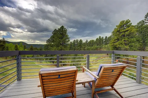 a view of a chairs and table on the terrace