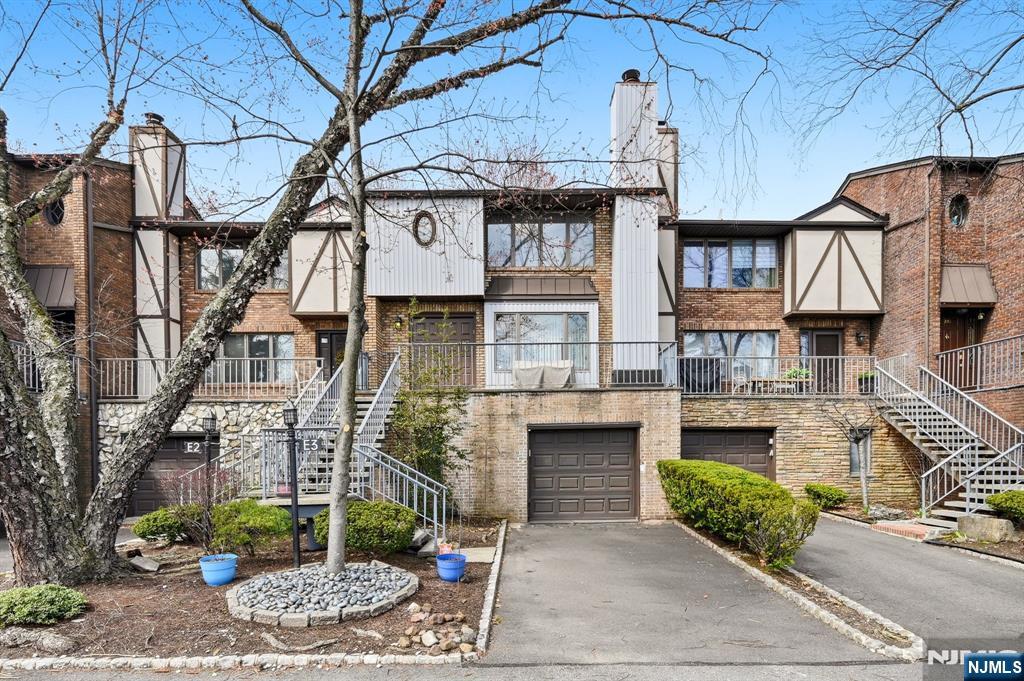 a front view of a building with garden