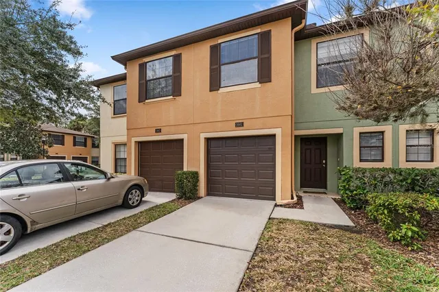 a view of a car parked in front of a house