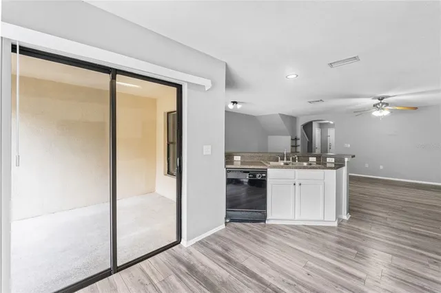 a kitchen with stainless steel appliances a refrigerator and a sink