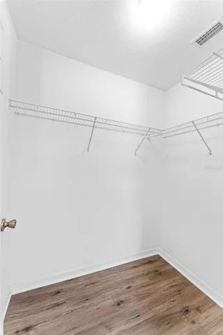 a view of a room with an empty walk in closet
