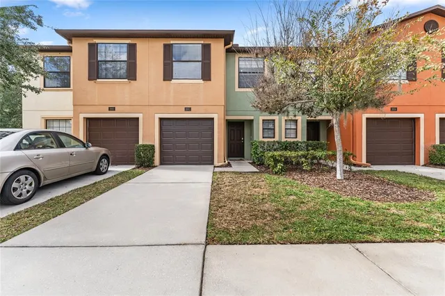 a view of a car parked in front of a house
