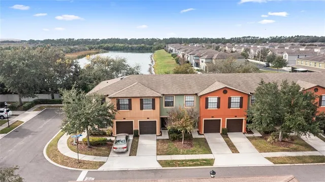 an aerial view of a house with lake view