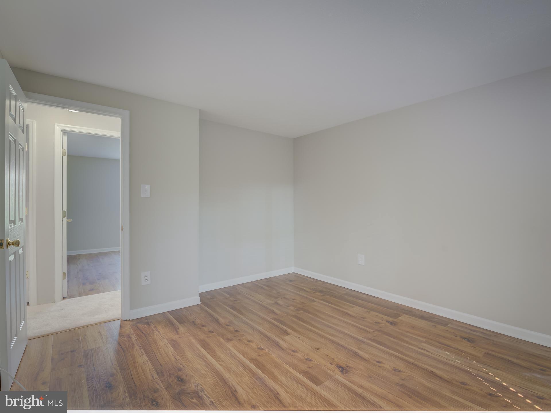 10833 Split Oak Lane Burke, VA 22015 - Photo 23 of 47 wooden floor in a room