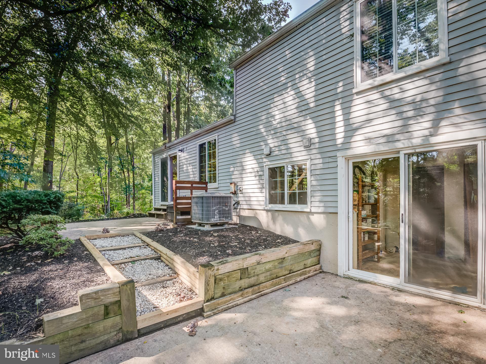 10833 Split Oak Lane Burke, VA 22015 - Photo 46 of 47 a view of backyard with large trees