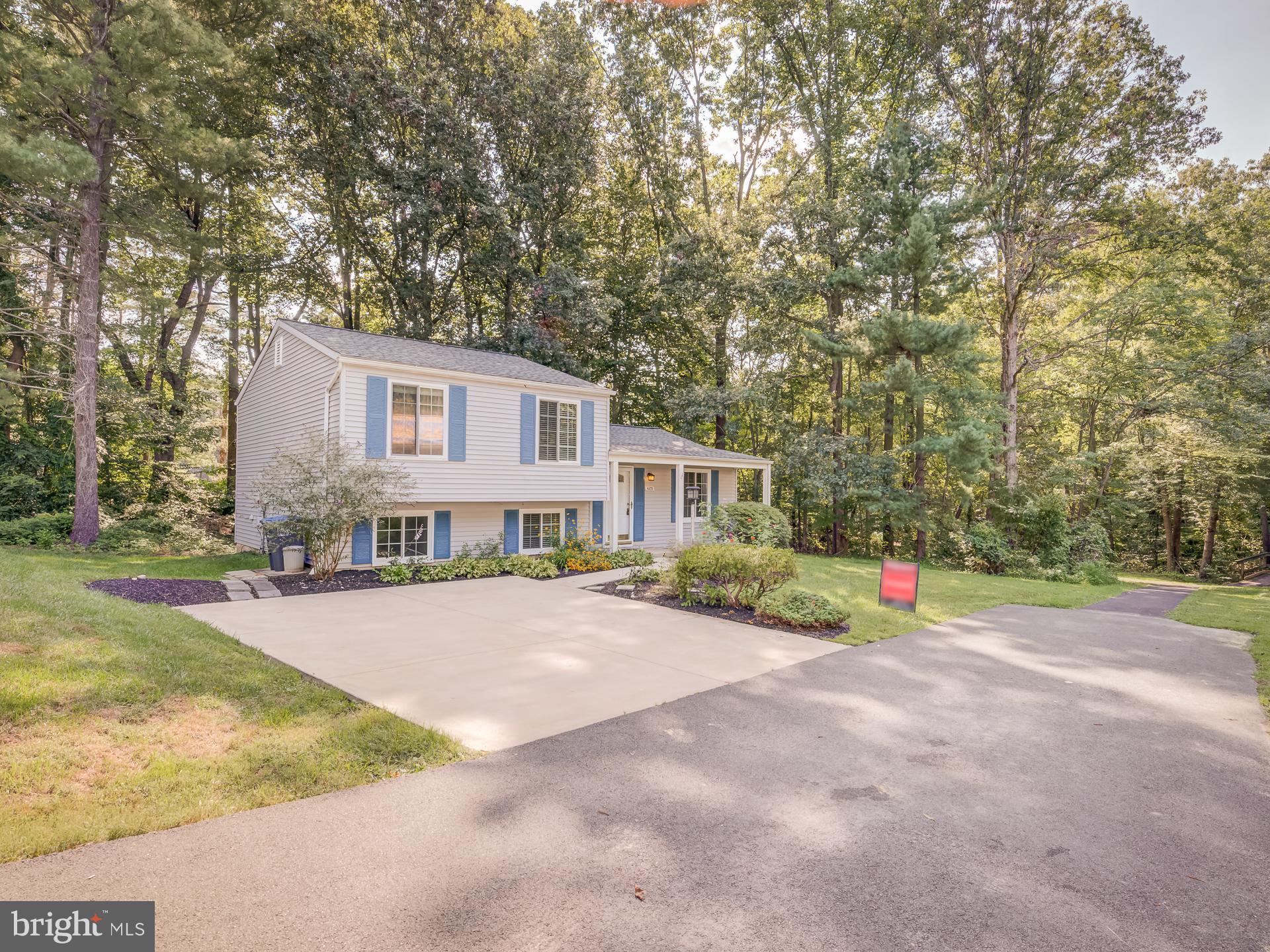 10833 Split Oak Lane Burke, VA 22015 - Photo 5 of 47 a view of a house with backyard and tree s