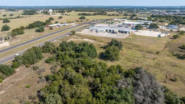 an aerial view of beach and residential space
