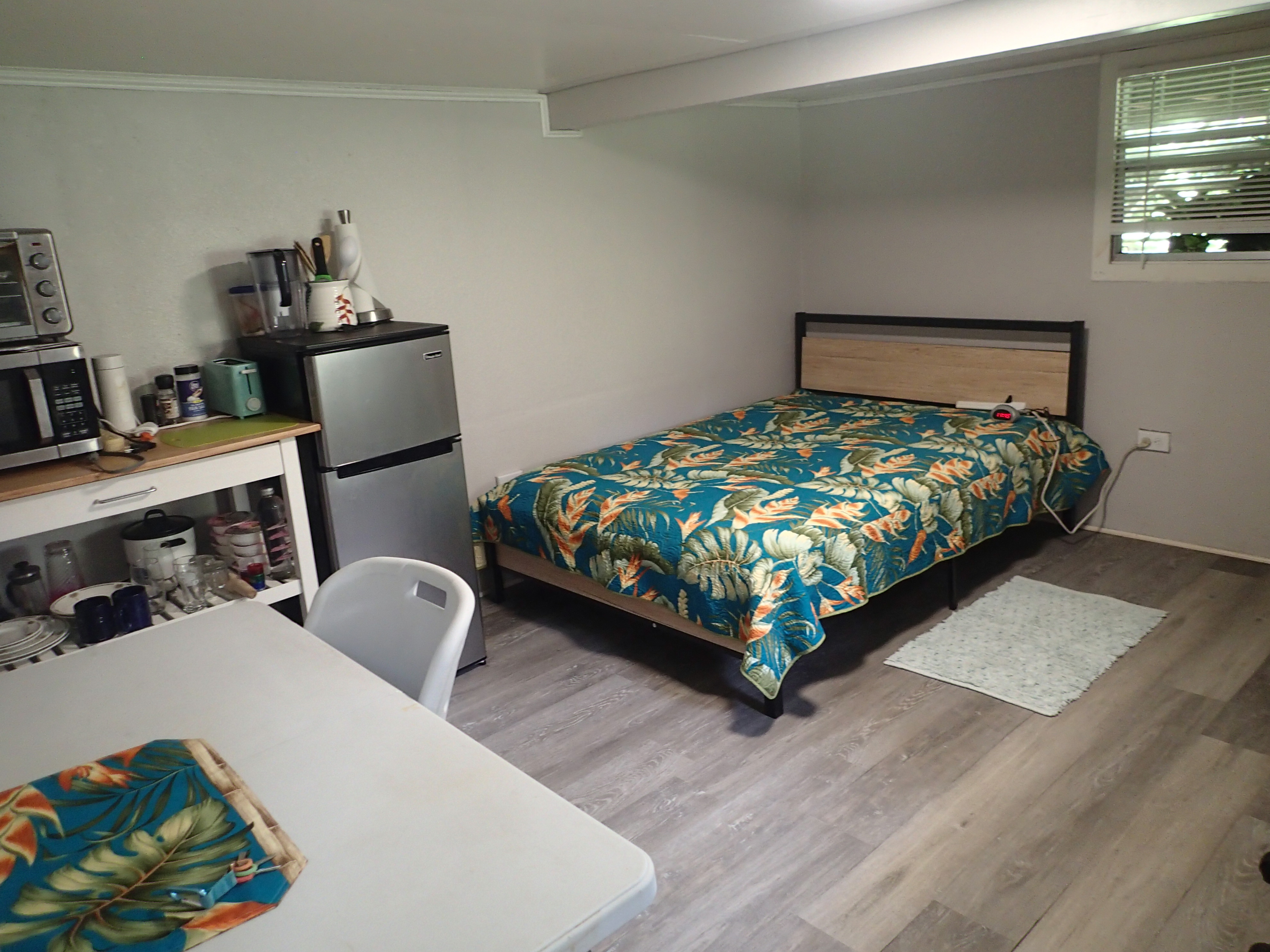 17-4100 Kukui Camp Road Kurtistown, HI 96760 - Photo 12 of 25 a bed sitting in a bedroom next to a window