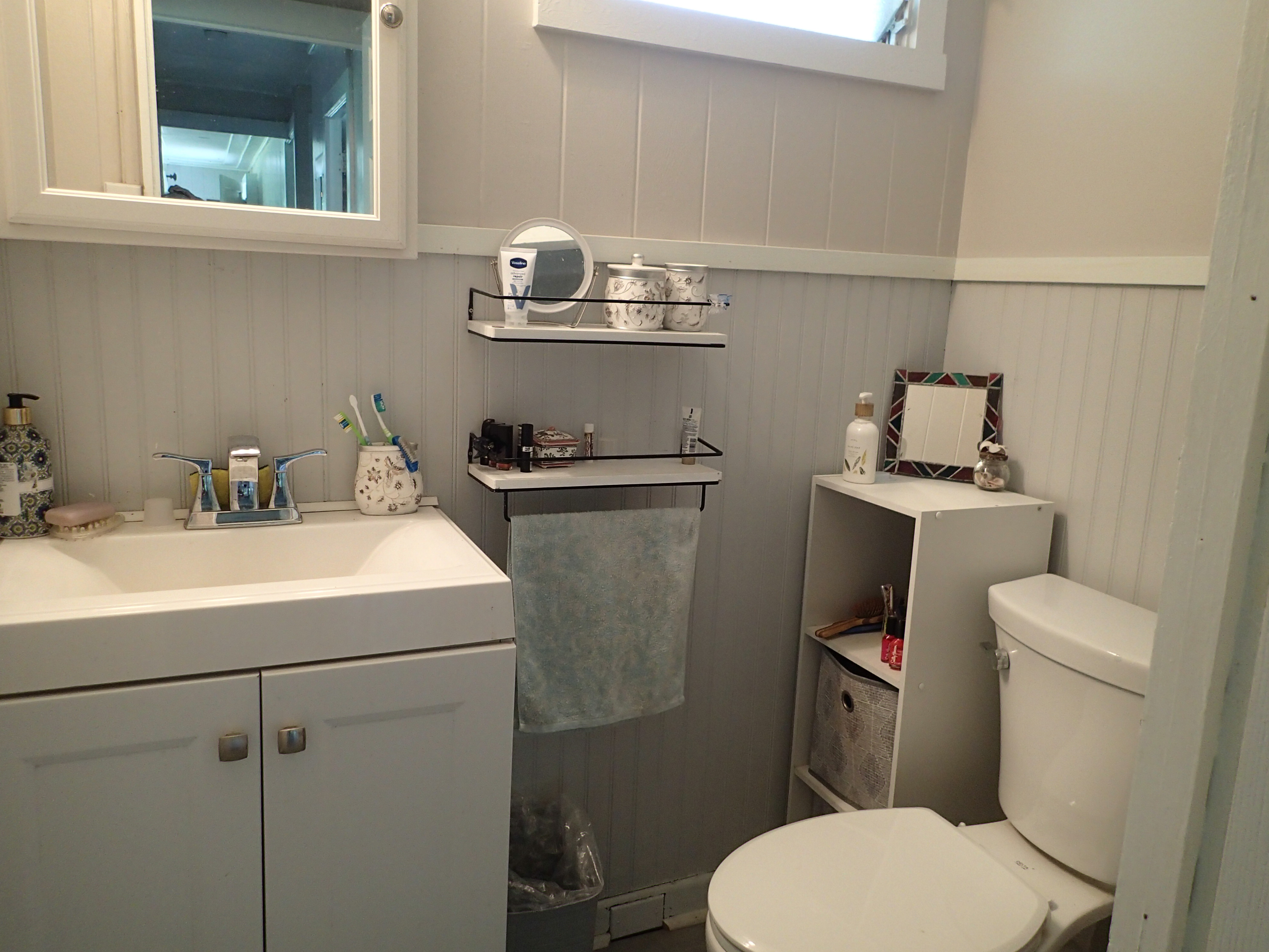 17-4100 Kukui Camp Road Kurtistown, HI 96760 - Photo 13 of 25 a bathroom with a sink a toilet and a mirror