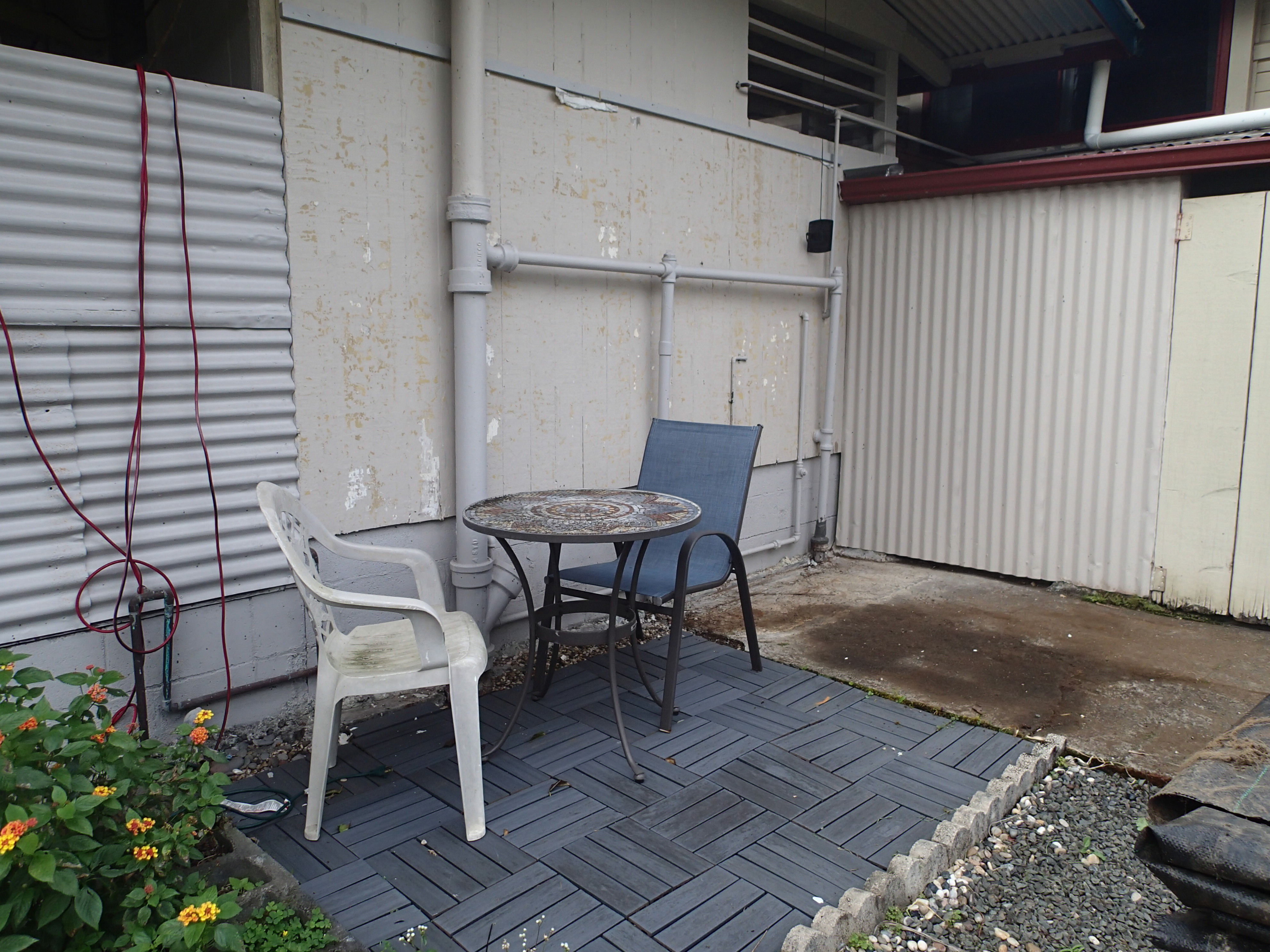 17-4100 Kukui Camp Road Kurtistown, HI 96760 - Photo 20 of 25 a patio with table and chairs and potted plants