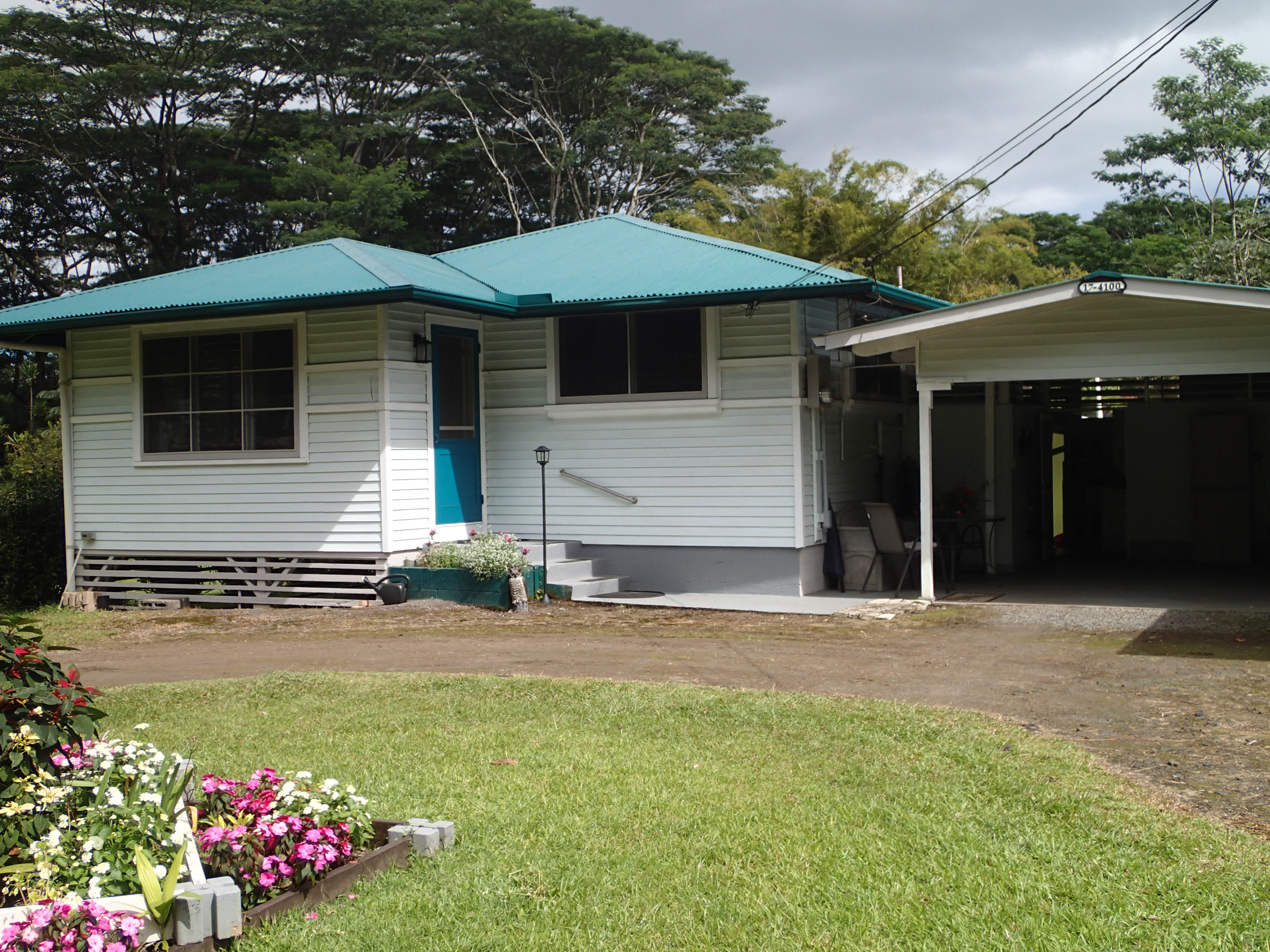 17-4100 Kukui Camp Road Kurtistown, HI 96760 - Photo 2 of 25 a front view of a house with a yard