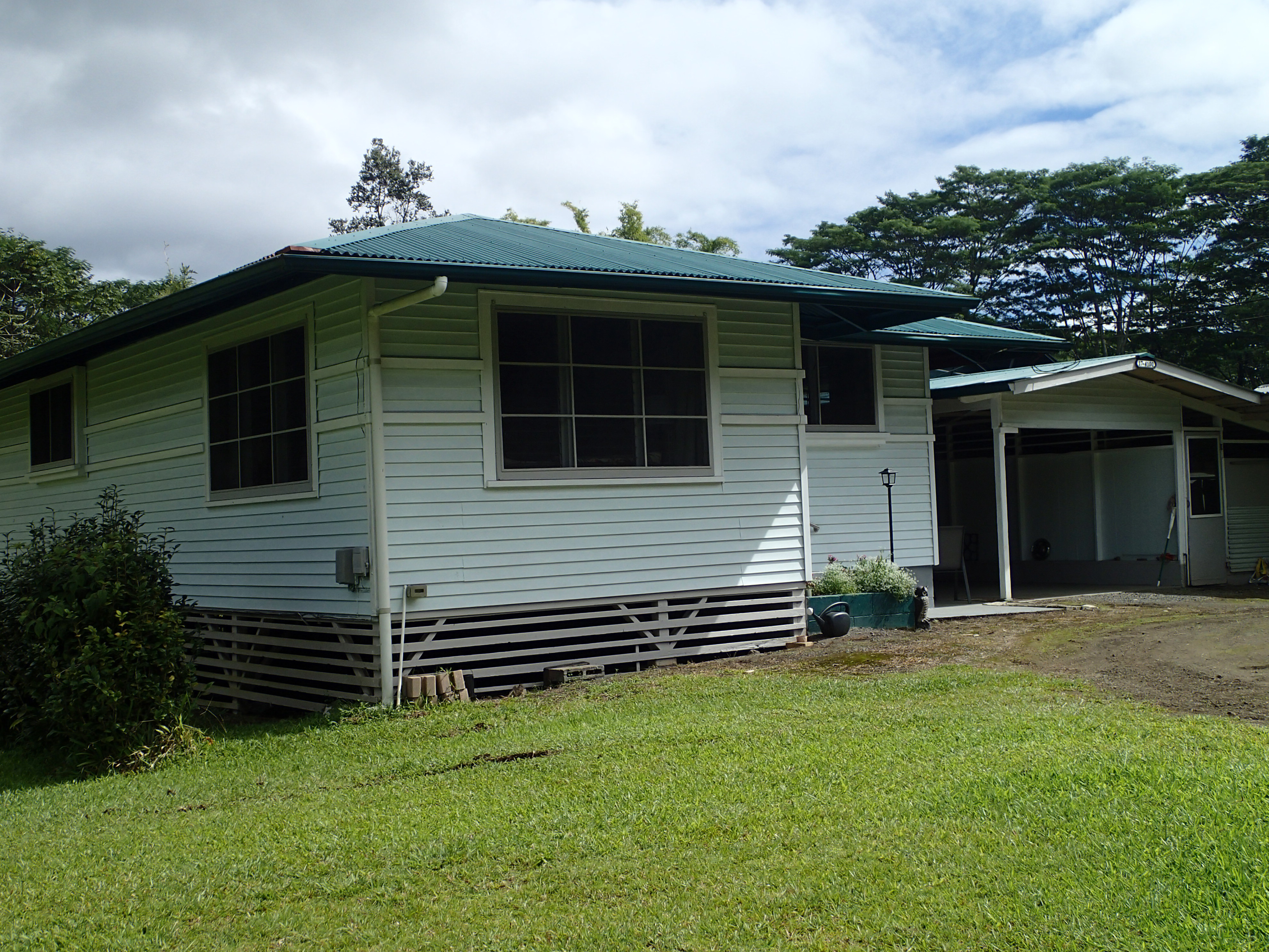 17-4100 Kukui Camp Road Kurtistown, HI 96760 - Photo 25 of 25 a front view of a house with a garden