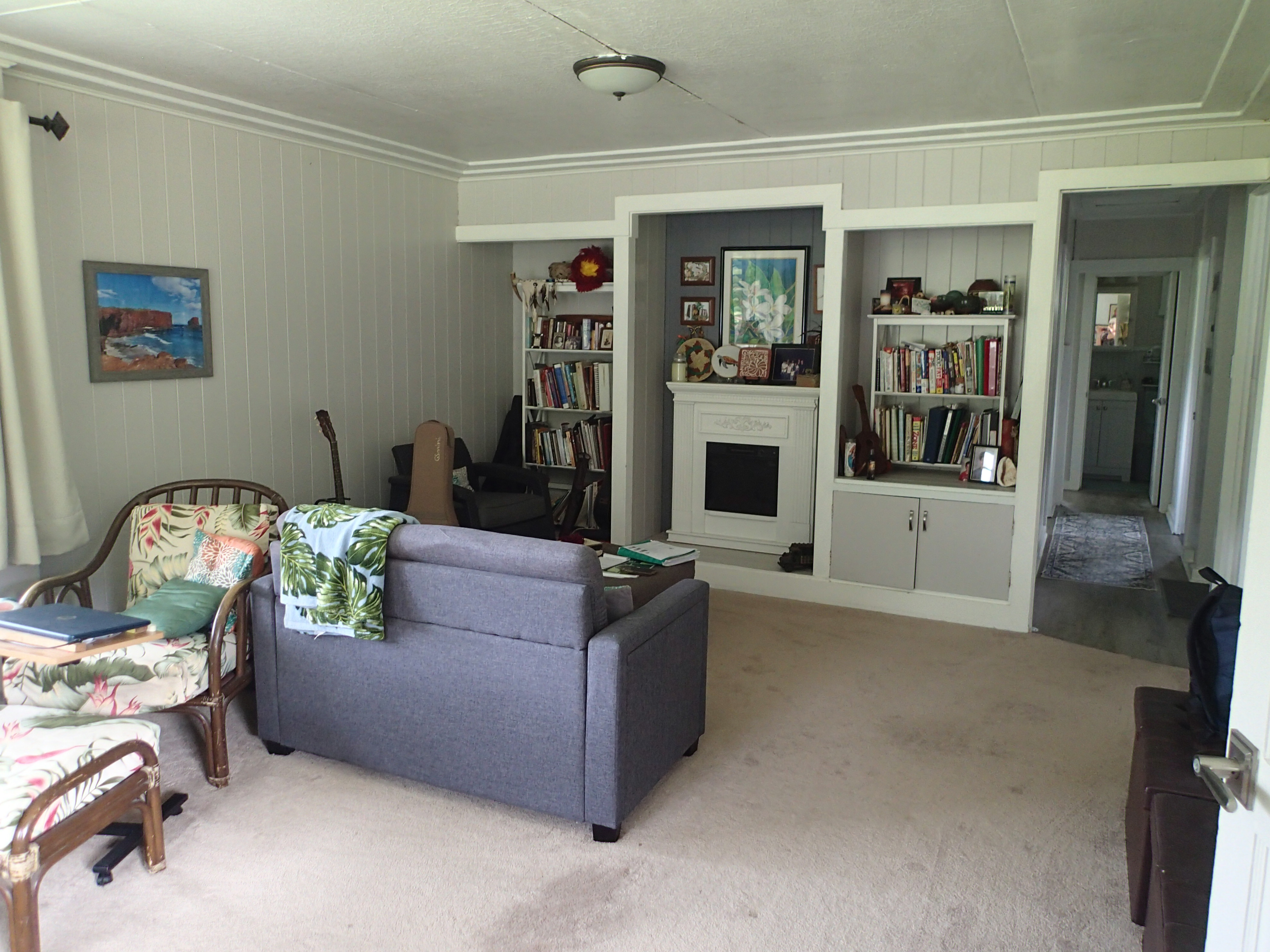 17-4100 Kukui Camp Road Kurtistown, HI 96760 - Photo 5 of 25 a living room with furniture and a fireplace
