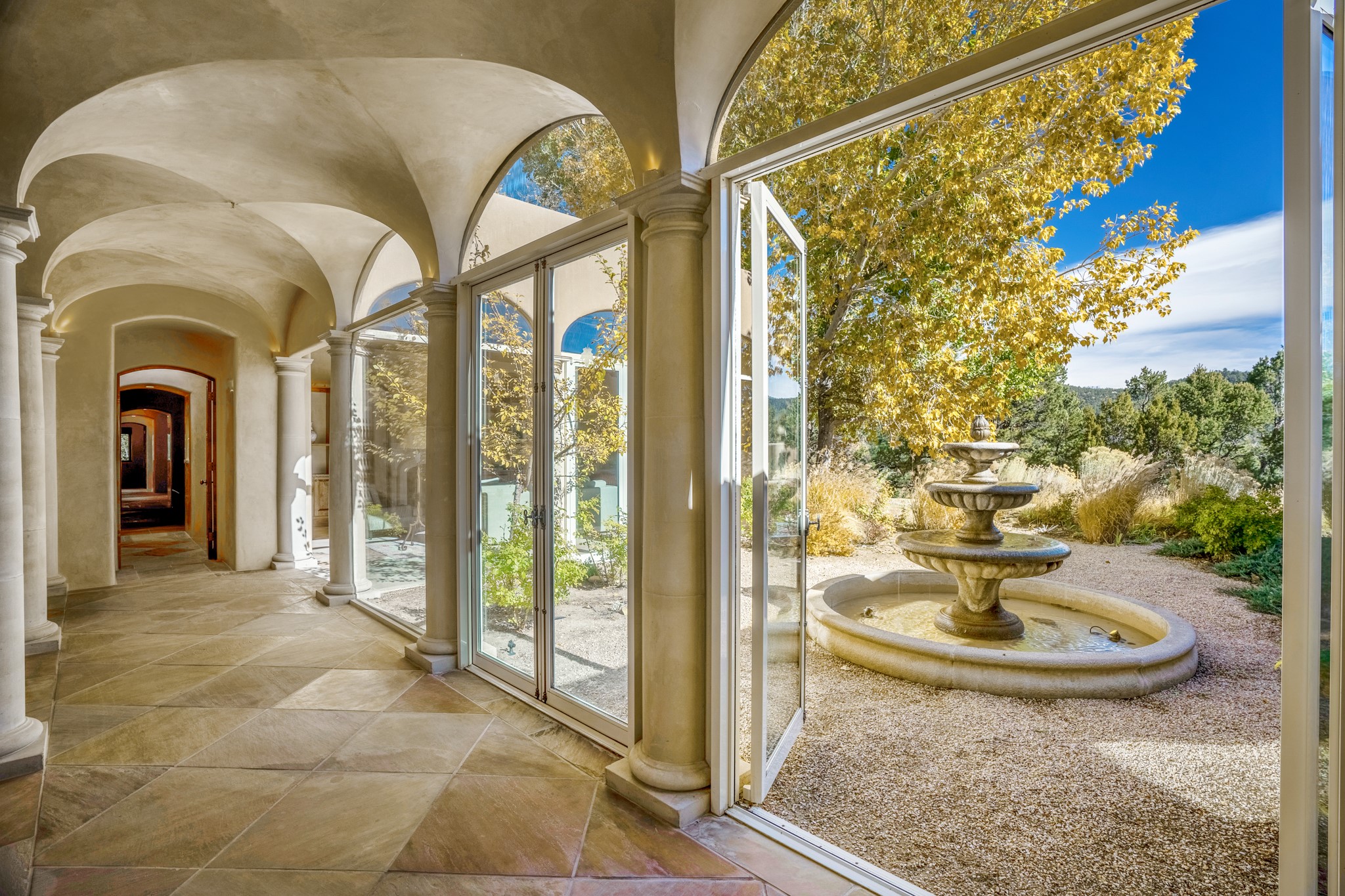 243 Double Arrow Road Santa Fe, NM 87505 - Photo 11 of 43 Hallway and Open Doors out to Central Courtyard