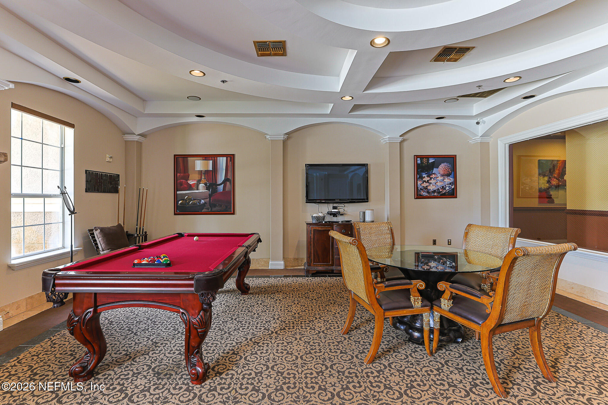 10961 Burnt Mill Road, Unit 426 Jacksonville, FL 32256 - Photo 21 of 24 a room with furniture a rug and a ceiling fan