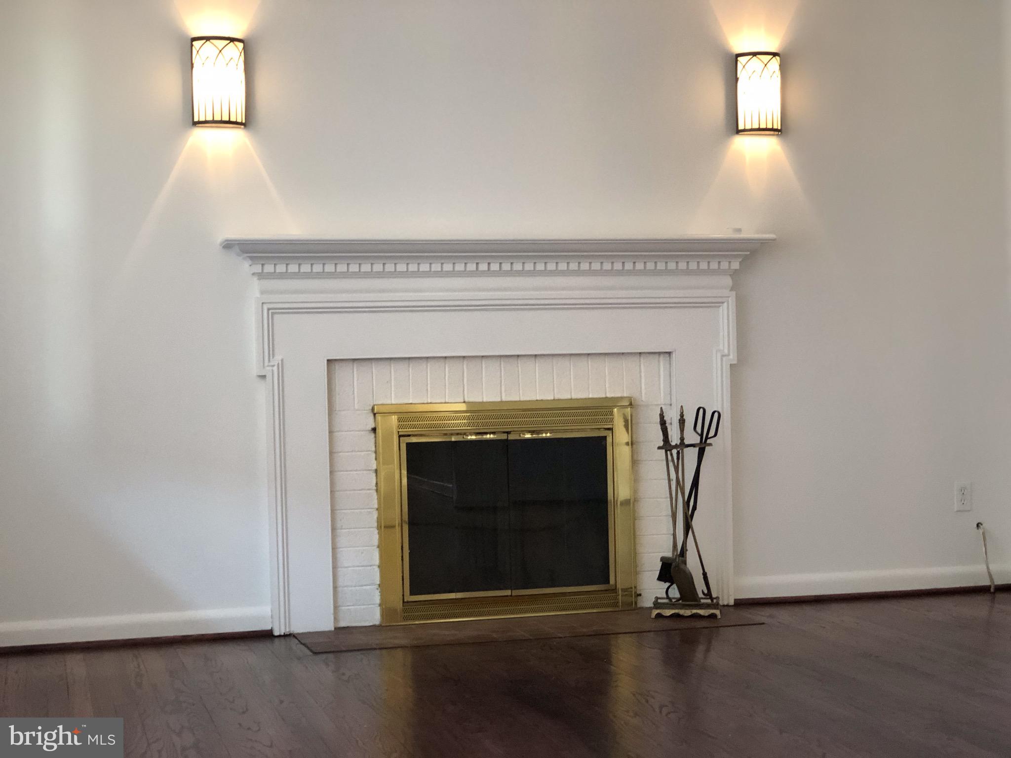 10005 Riggs Road Adelphi, MD 20783 - Photo 2 of 32 a living room with a fireplace