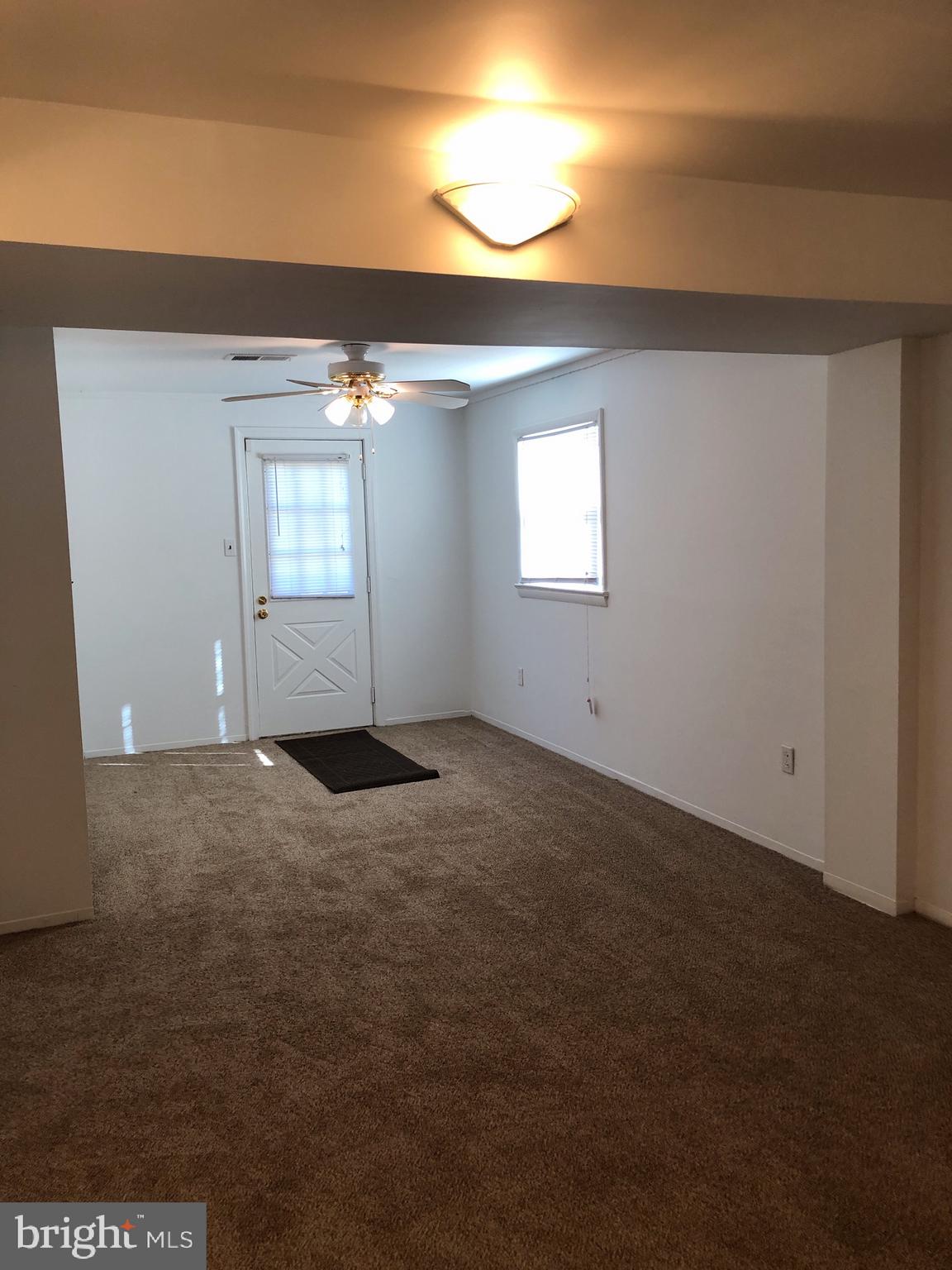 10005 Riggs Road Adelphi, MD 20783 - Photo 18 of 32 an empty room with windows and closet