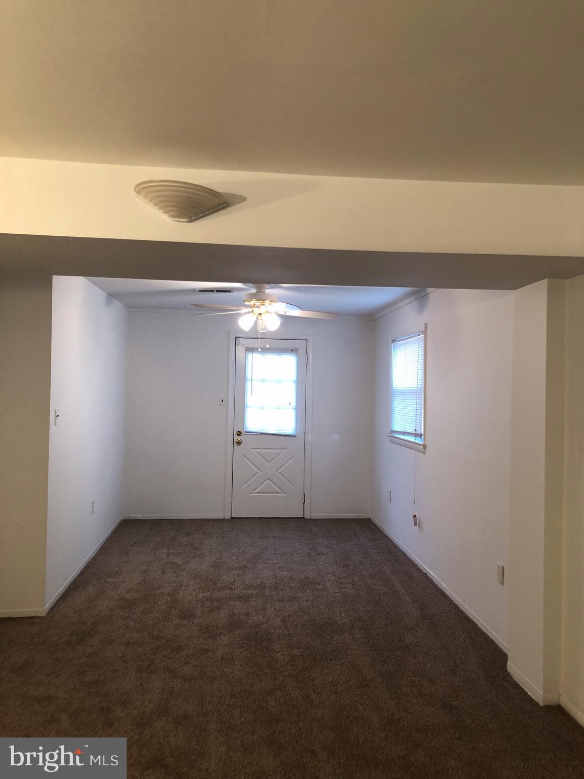 10005 Riggs Road Adelphi, MD 20783 - Photo 19 of 32 an empty room with windows