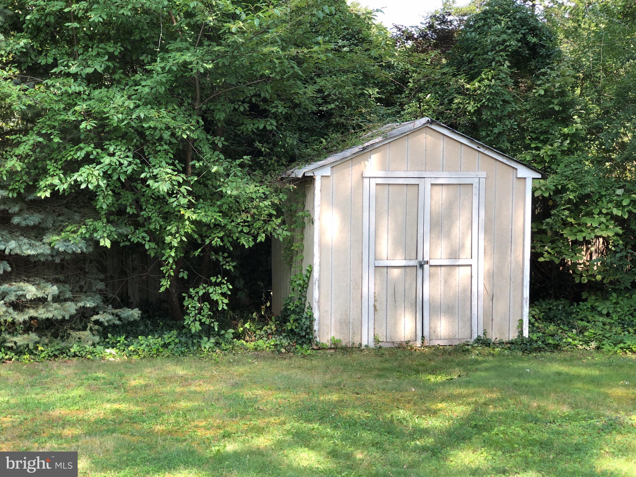10005 Riggs Road Adelphi, MD 20783 - Photo 27 of 32 a front view of a house with garden