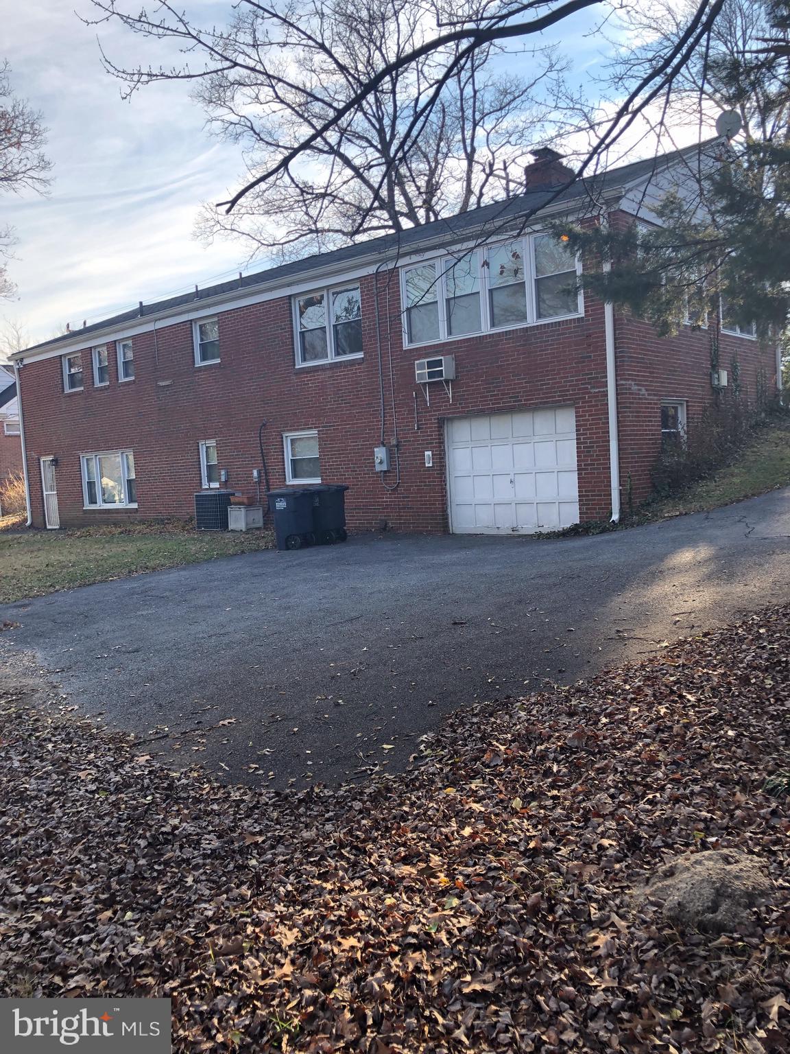 10005 Riggs Road Adelphi, MD 20783 - Photo 31 of 32 a view of a house with a yard