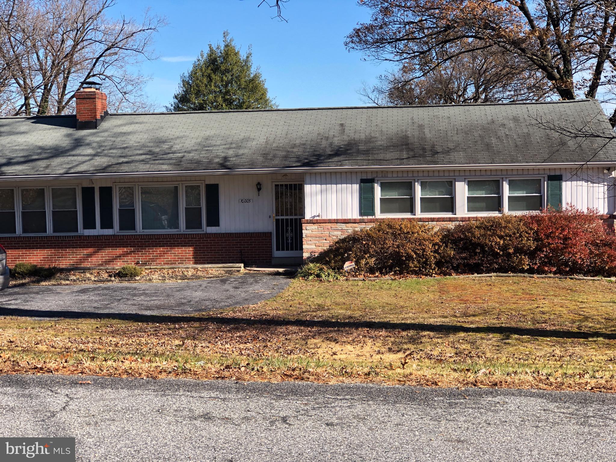 10005 Riggs Road Adelphi, MD 20783 - Photo 32 of 32 a front view of house with yard