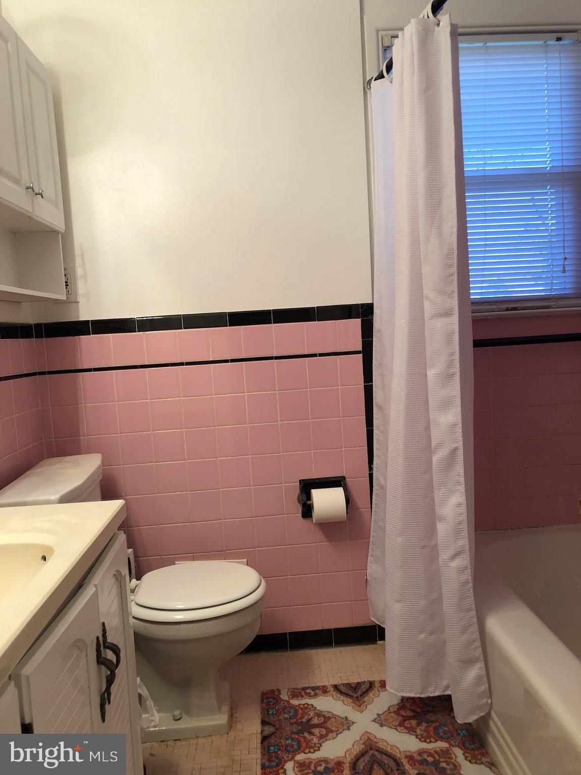 10005 Riggs Road Adelphi, MD 20783 - Photo 8 of 32 a bathroom with a sink a toilet and shower