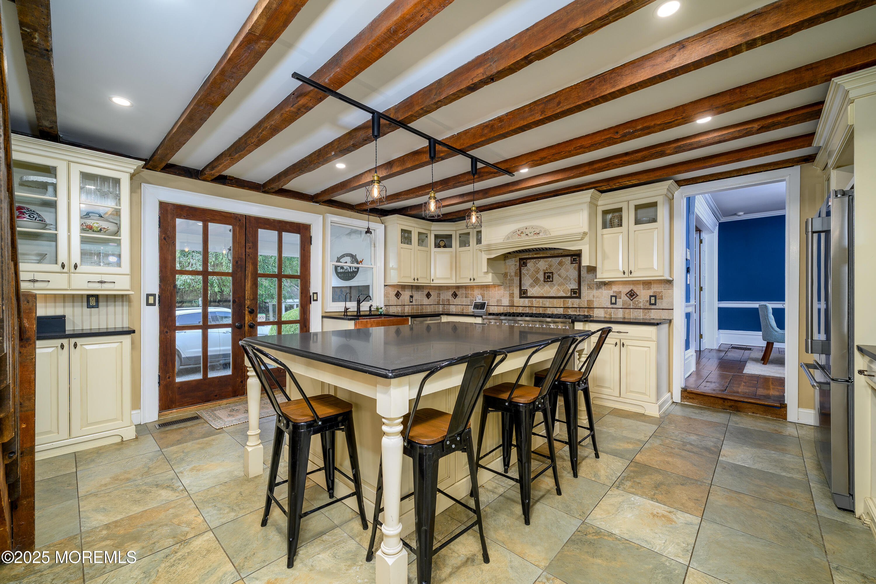 60 Conover Road Colts Neck, NJ 07722 - Photo 13 of 56 a kitchen with stainless steel appliances granite countertop a table chairs and a refrigerator