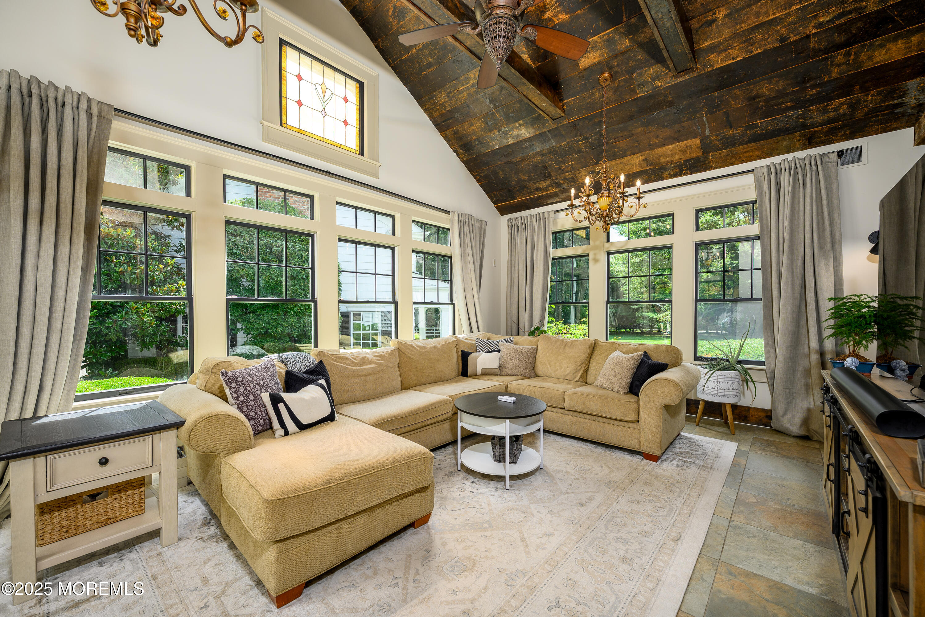 60 Conover Road Colts Neck, NJ 07722 - Photo 17 of 56 a living room with furniture and floor to ceiling windows