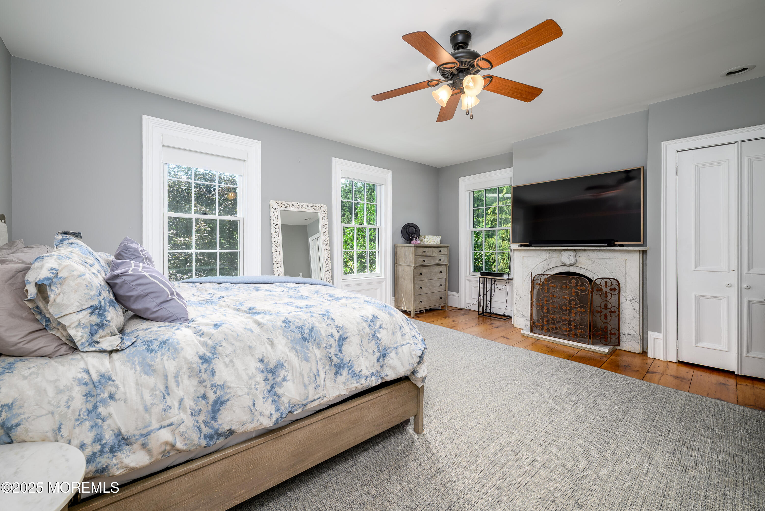 60 Conover Road Colts Neck, NJ 07722 - Photo 23 of 56 a bedroom with a bed and a flat screen tv