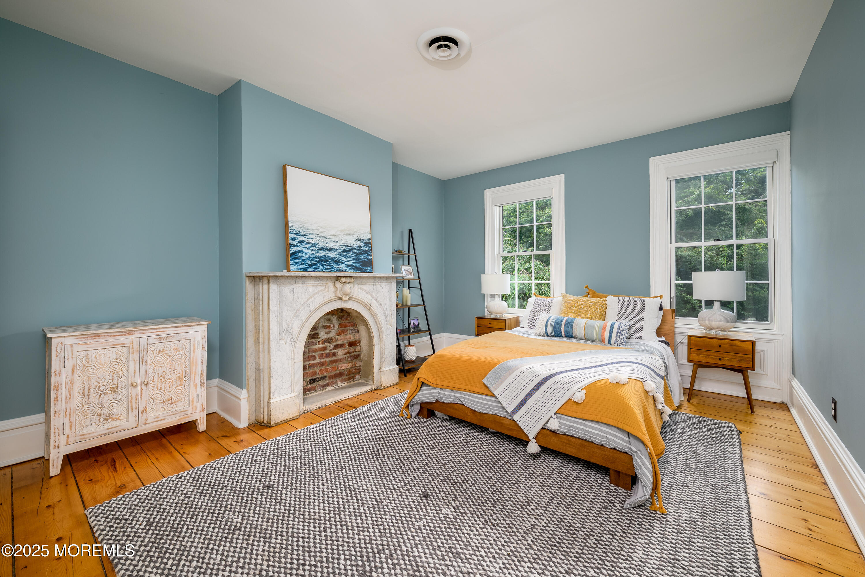 60 Conover Road Colts Neck, NJ 07722 - Photo 30 of 56 a bedroom with a bed and a fireplace