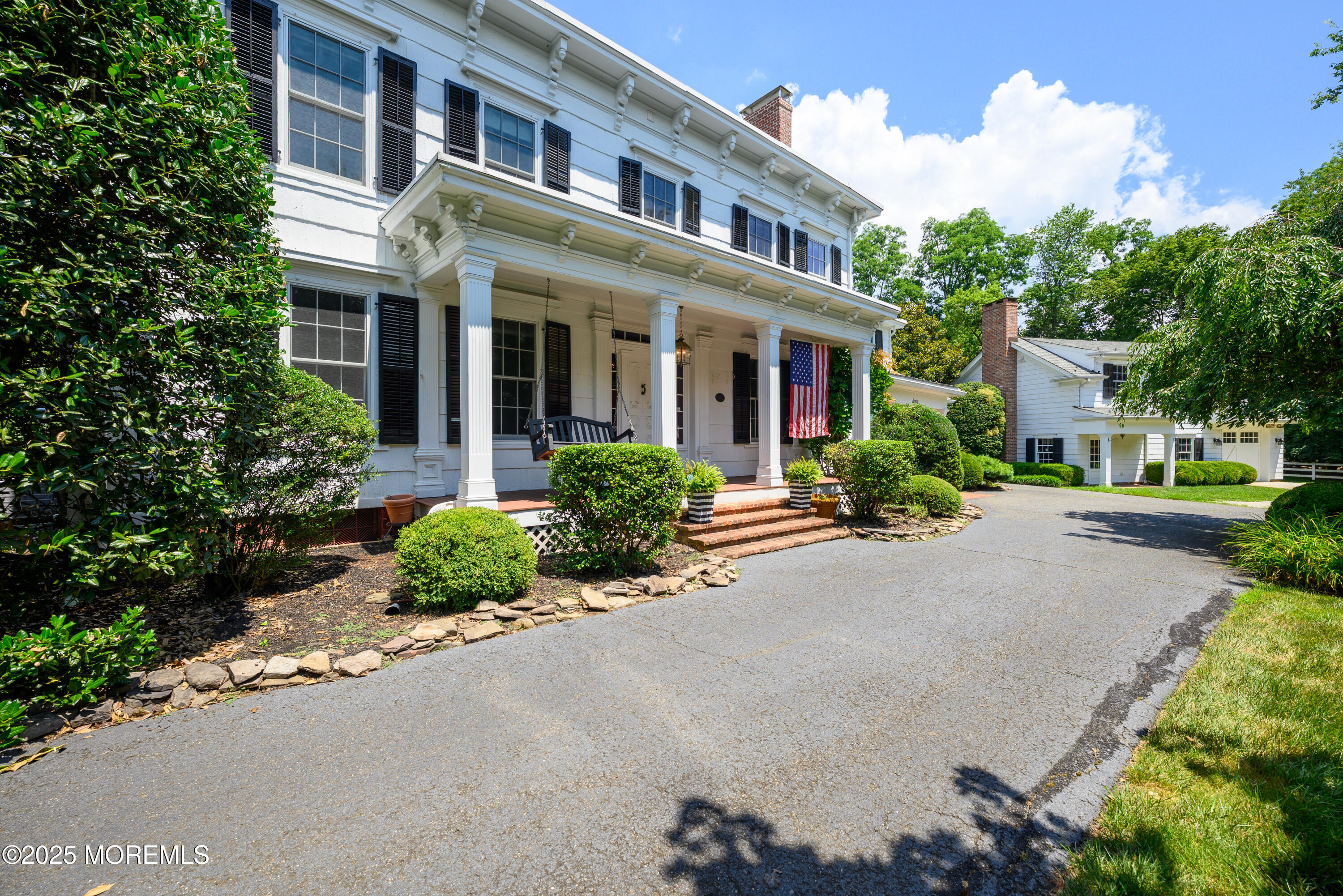 60 Conover Road Colts Neck, NJ 07722 - Photo 3 of 56 front view of a house with a yard