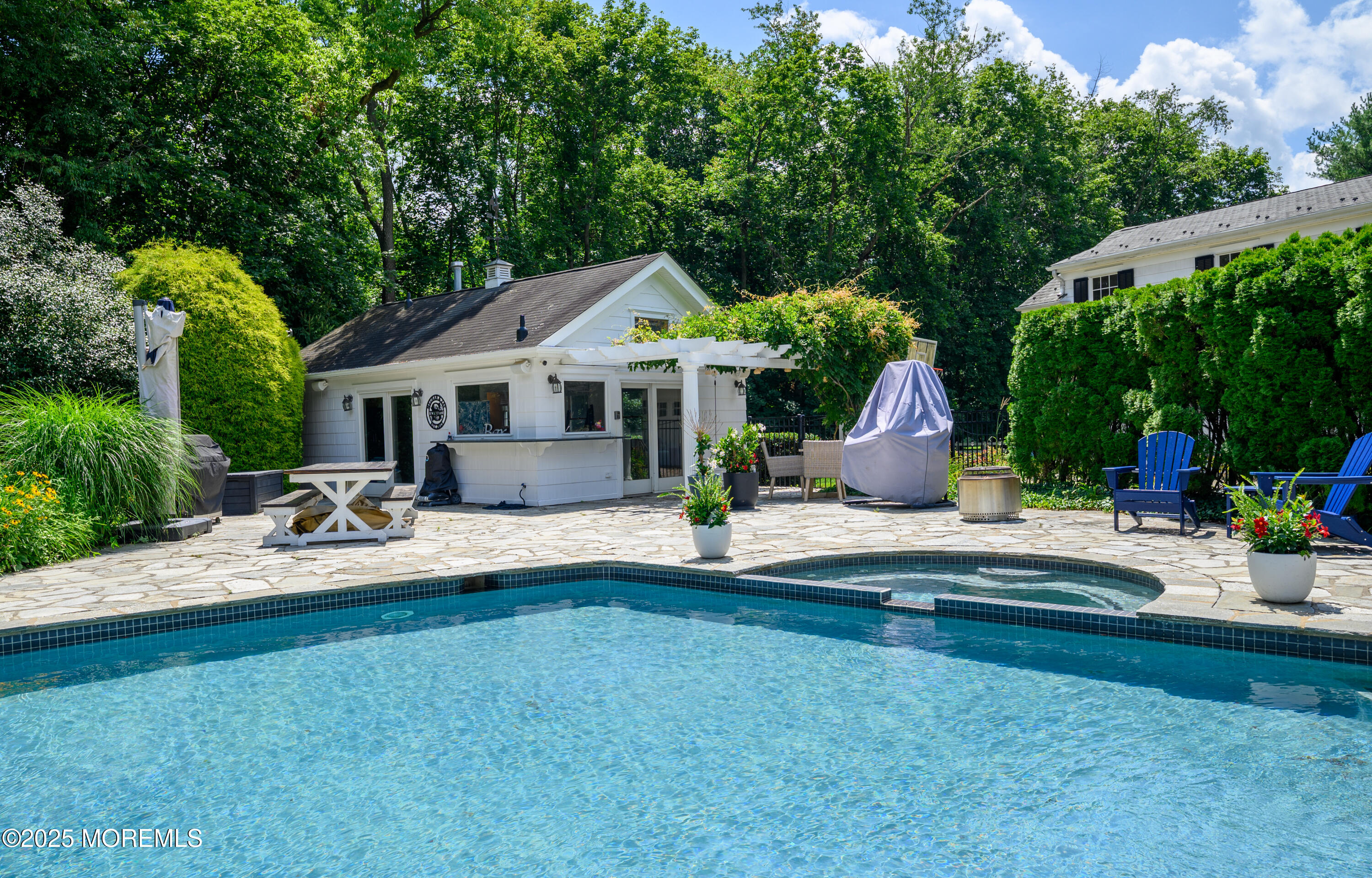 60 Conover Road Colts Neck, NJ 07722 - Photo 34 of 56 a front view of house with yard and outdoor seating