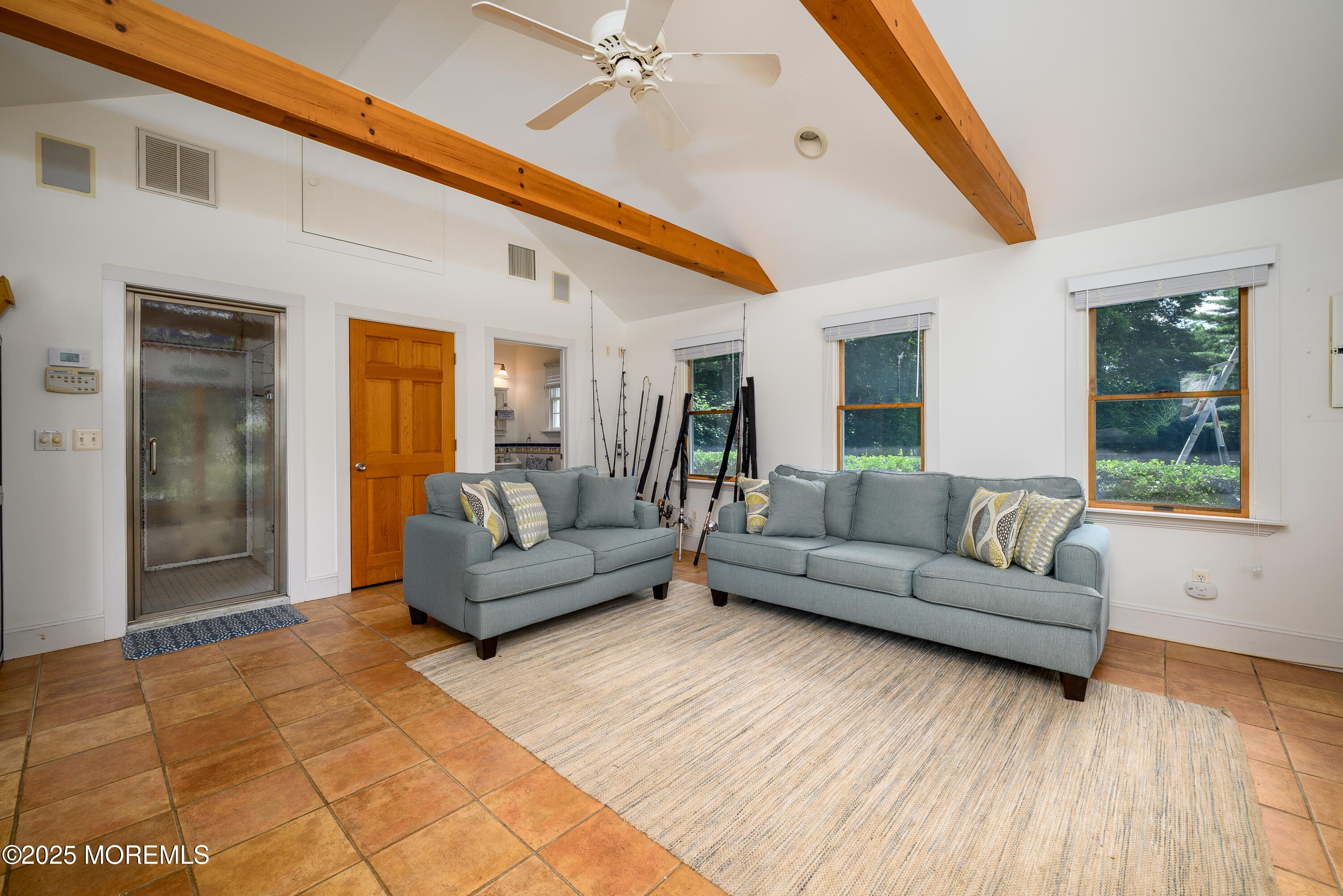 60 Conover Road Colts Neck, NJ 07722 - Photo 35 of 56 a living room with furniture and a large window