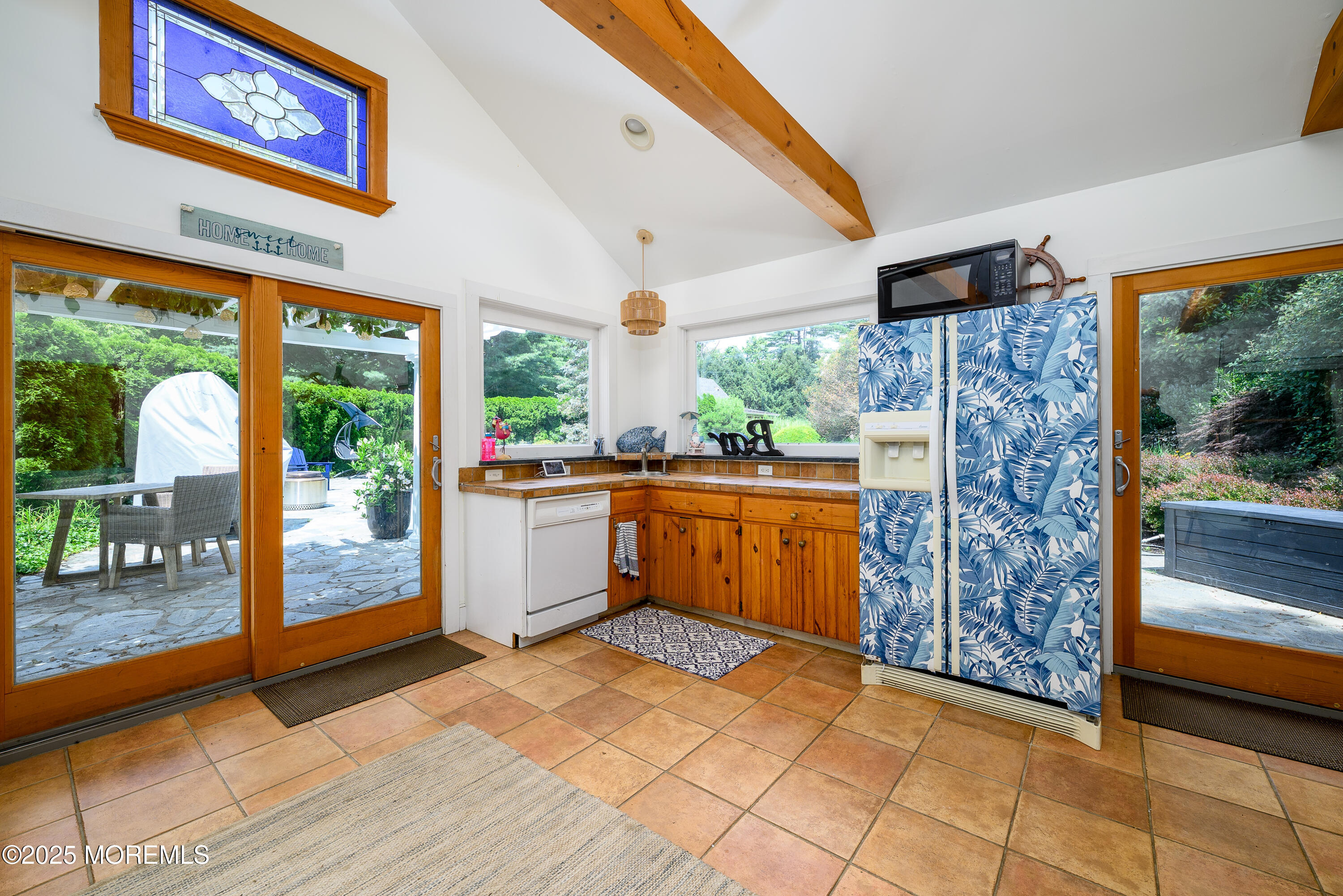 60 Conover Road Colts Neck, NJ 07722 - Photo 36 of 56 a kitchen with stainless steel appliances granite countertop a stove a sink and a refrigerator