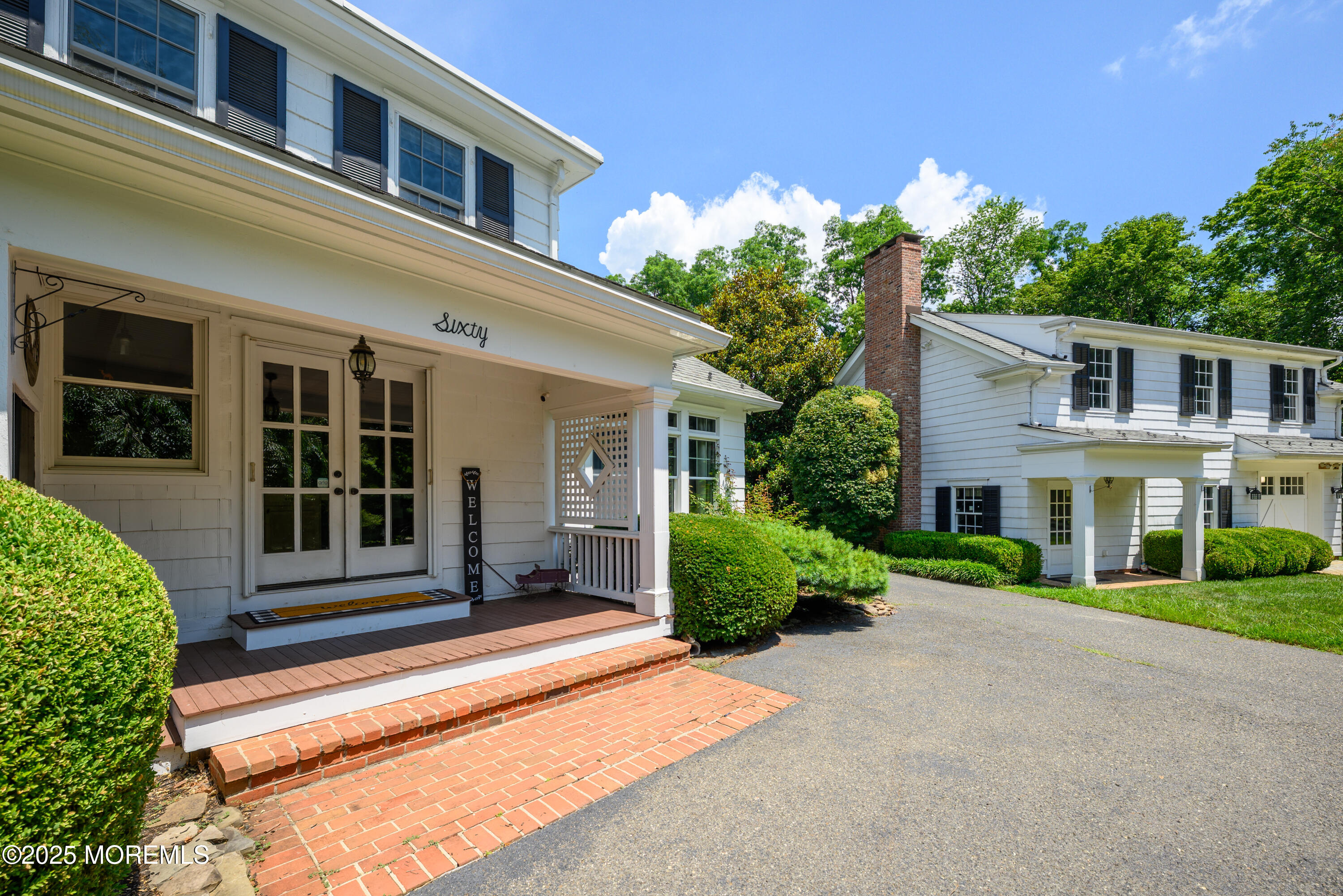 60 Conover Road Colts Neck, NJ 07722 - Photo 45 of 56 a front view of a house with a yard