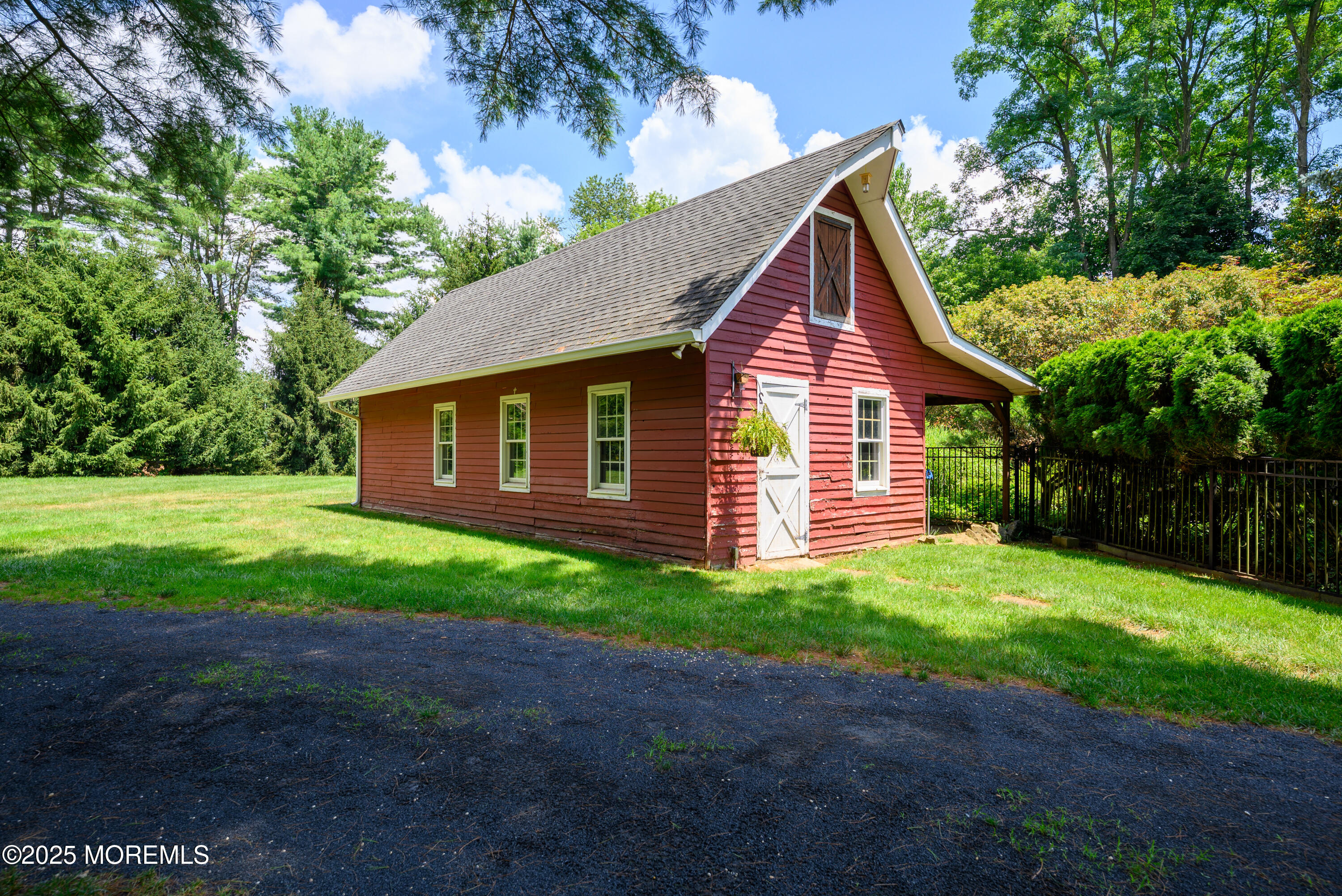 60 Conover Road Colts Neck, NJ 07722 - Photo 47 of 56 a front view of a house with garden